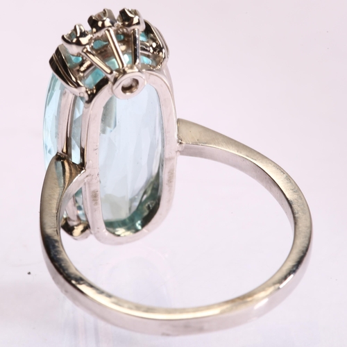 1121 - A modern 18ct white gold aquamarine and diamond dress ring, set with long oval mixed-cut aquamarine ... 