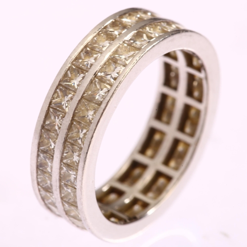 1122 - A platinum double-row full eternity ring, set with Princess-cut diamonds, total diamond content appr... 