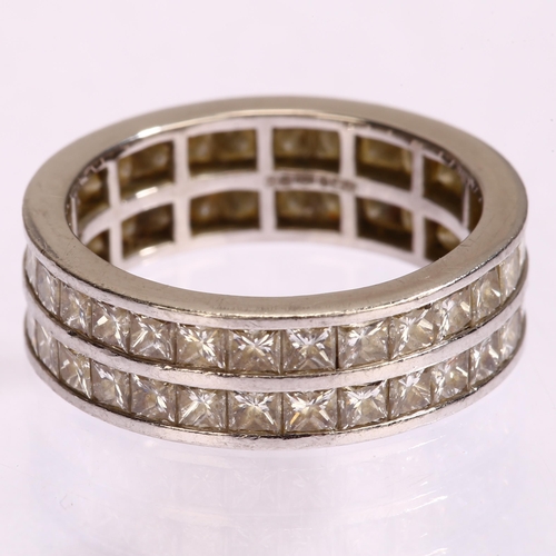 1122 - A platinum double-row full eternity ring, set with Princess-cut diamonds, total diamond content appr... 