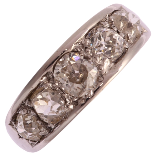 1123 - A graduated five stone diamond half hoop ring, unmarked white metal settings with old-cut diamonds, ... 