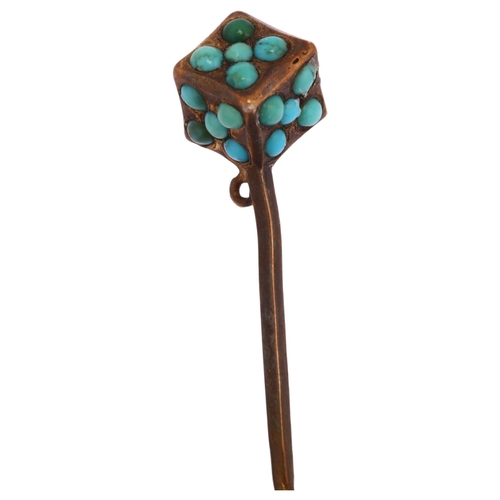 1125 - A Victorian turquoise dice stickpin, unmarked yellow metal settings with round cabochon turquoise, h... 