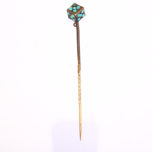 1125 - A Victorian turquoise dice stickpin, unmarked yellow metal settings with round cabochon turquoise, h... 