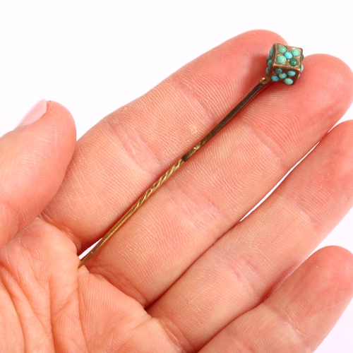 1125 - A Victorian turquoise dice stickpin, unmarked yellow metal settings with round cabochon turquoise, h... 