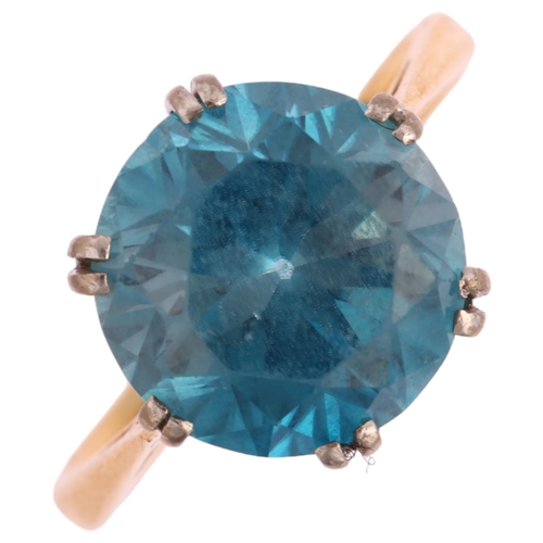 1128 - An early 20th century 18ct gold solitaire blue zircon ring, set with 6.4ct round brilliant-cut zirco... 