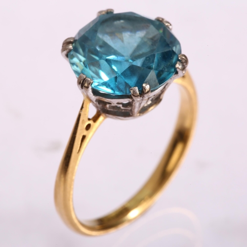 1128 - An early 20th century 18ct gold solitaire blue zircon ring, set with 6.4ct round brilliant-cut zirco... 