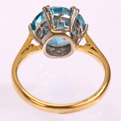 1128 - An early 20th century 18ct gold solitaire blue zircon ring, set with 6.4ct round brilliant-cut zirco... 