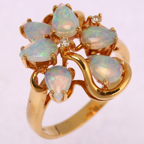 1130 - An 18ct gold opal and diamond openwork cocktail ring, set with pear cabochon opal and modern round b... 