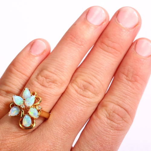 1130 - An 18ct gold opal and diamond openwork cocktail ring, set with pear cabochon opal and modern round b... 