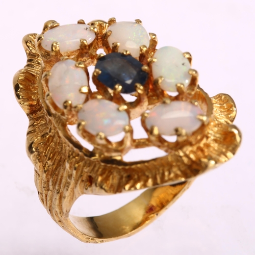 1134 - A late 20th century sapphire and opal openwork cluster ring, unmarked gold textured settings, with o... 