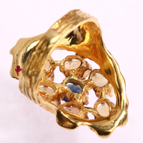 1134 - A late 20th century sapphire and opal openwork cluster ring, unmarked gold textured settings, with o... 