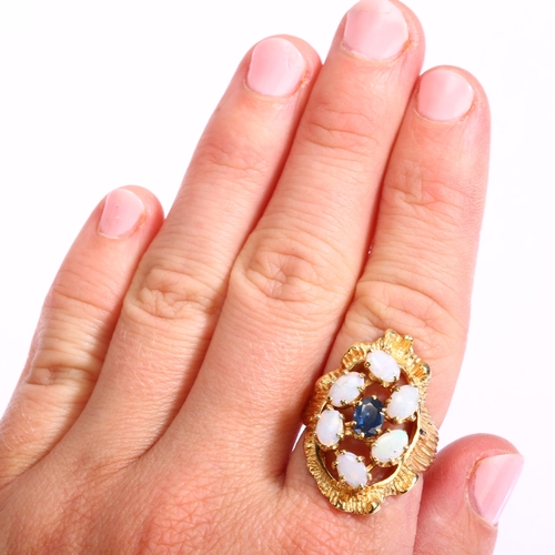 1134 - A late 20th century sapphire and opal openwork cluster ring, unmarked gold textured settings, with o... 