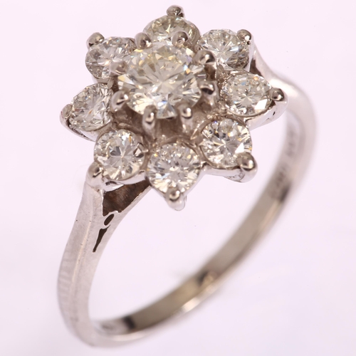 1144 - An 18ct white gold diamond flowerhead cluster ring, set with modern round brilliant-cut diamonds, to... 