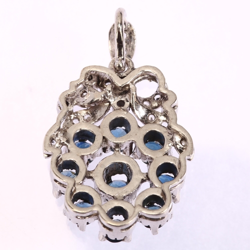 1146 - A late 20th century sapphire and diamond target cluster pendant, unmarked white metal settings test ... 