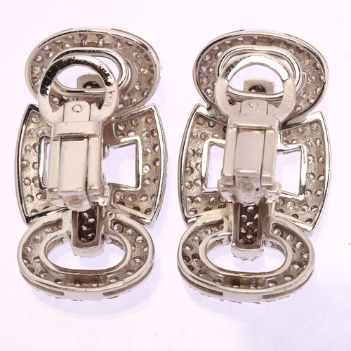 1148 - A pair of modern 18ct white gold diamond panel earrings, geometric design with square and oval panel... 