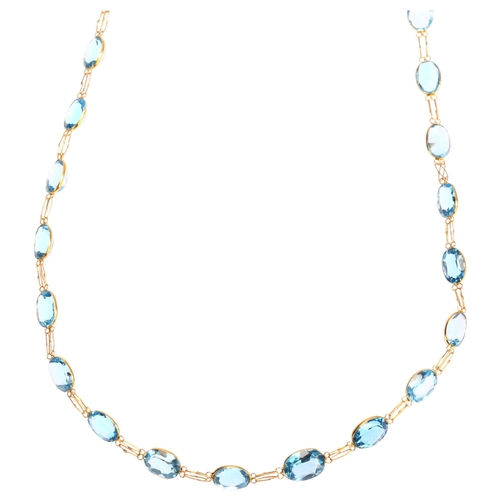 1155 - A 14ct gold blue topaz line necklace, set with oval mixed-cut topaz, length 50cm, 8.7g