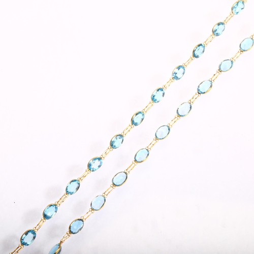 1155 - A 14ct gold blue topaz line necklace, set with oval mixed-cut topaz, length 50cm, 8.7g