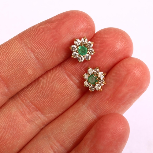 1157 - A pair of emerald and diamond flowerhead cluster earrings, unmarked gold settings with stud fittings... 