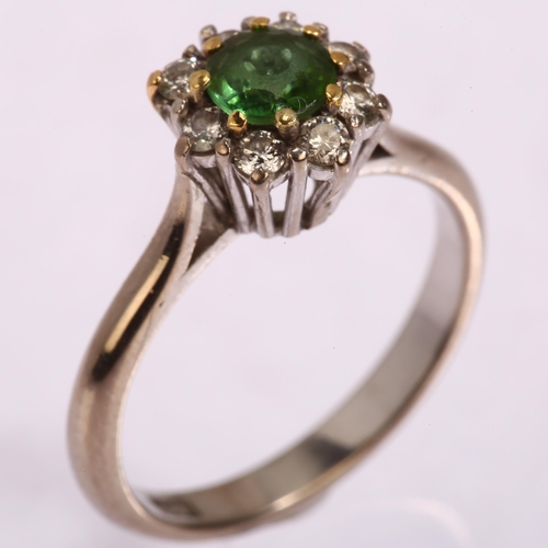 1158 - An 18ct gold emerald and diamond flowerhead cluster ring, setting height 9.4mm, size N, 4.2g