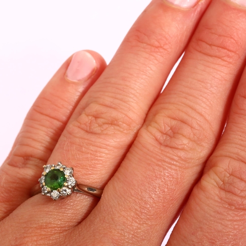 1158 - An 18ct gold emerald and diamond flowerhead cluster ring, setting height 9.4mm, size N, 4.2g