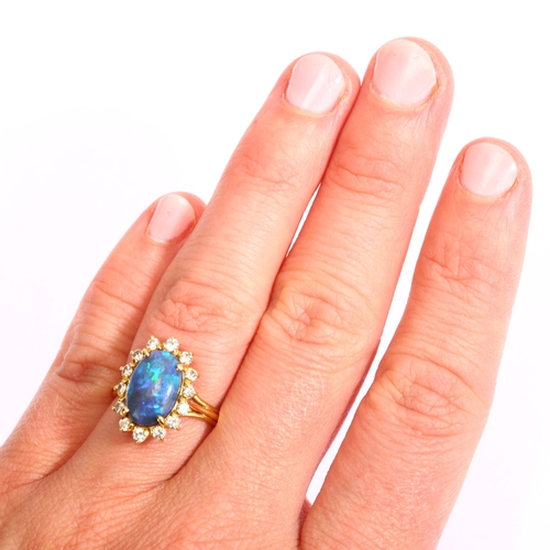 1161 - A modern 18ct gold black opal and diamond oval cluster ring, set with oval cabochon opal and modern ... 