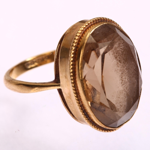 1162 - A mid-20th century 9ct gold smoky quartz dress ring, set with oval mixed-cut quartz, setting height ... 