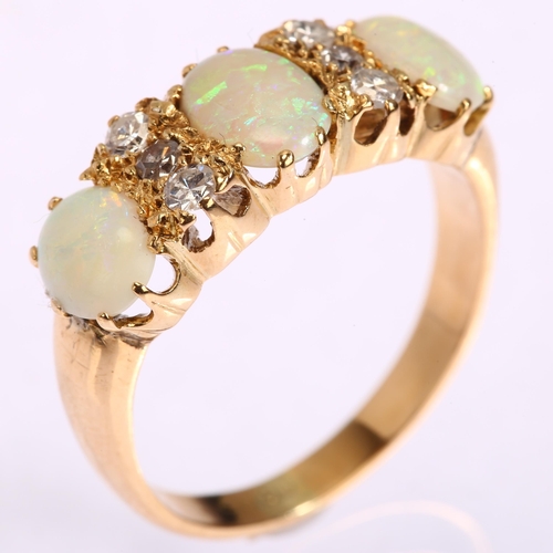 1166 - An early 20th century 18ct gold nine stone opal and diamond half hoop ring, set with oval cabochon o... 