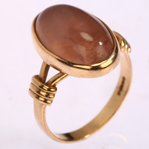 1171 - A 9ct gold rose quartz dress ring, set with oval cabochon quartz, Birmingham 1993, setting height 18... 