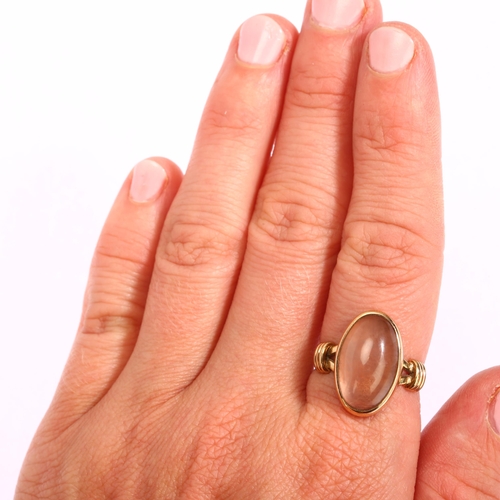 1171 - A 9ct gold rose quartz dress ring, set with oval cabochon quartz, Birmingham 1993, setting height 18... 