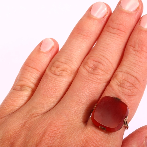 1177 - An early 20th century carnelian signet ring, unmarked rose gold settings, carnelian 17.4 x 16.3mm, s... 