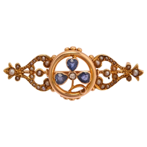 1181 - An Edwardian 15ct gold sapphire diamond and pearl shamrock openwork brooch, length 39.7mm, 4.3g