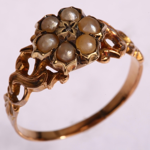 1192 - A 19th century diamond and split pearl mourning ring, unmarked gold settings with central flowerhead... 