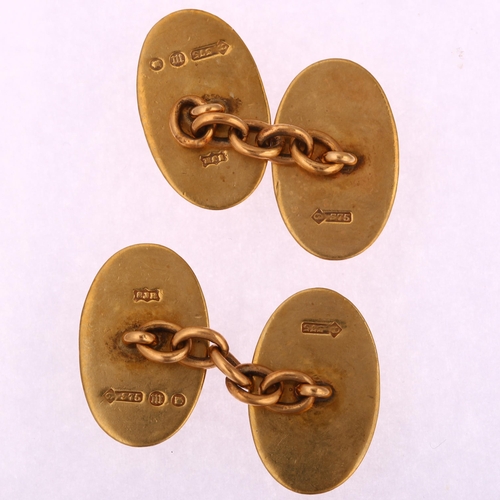 1194 - A pair of Art Deco 9ct gold oval cufflinks, with engine turned decoration, London 1927, length 18.2m... 