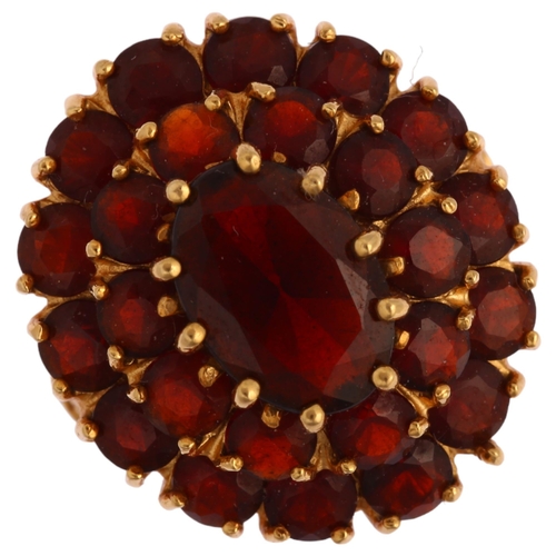 1195 - A Continental 18ct gold garnet oval cluster ring, set with oval mixed and round-cut garnets, setting... 