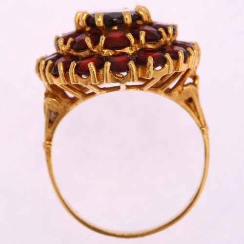 1195 - A Continental 18ct gold garnet oval cluster ring, set with oval mixed and round-cut garnets, setting... 