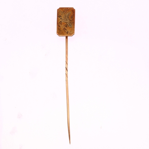 1205 - A Victorian Aesthetic Movement bird stickpin, unmarked gold settings, head height 17.9mm, overall 81... 