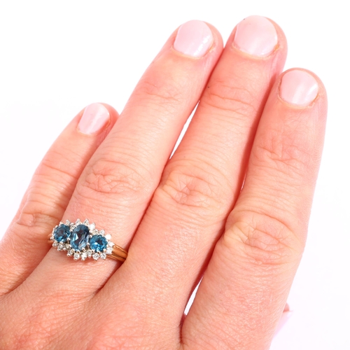 1208 - A modern 9ct gold blue topaz and diamond triple cluster ring, setting height 9.6mm, size K, 3.1g