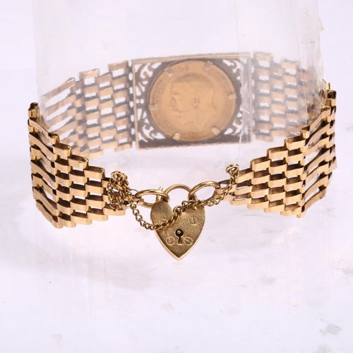 1218 - A George V 1914 gold full sovereign coin, in 9ct gatelink bracelet mount, with 9ct heart padlock cla... 