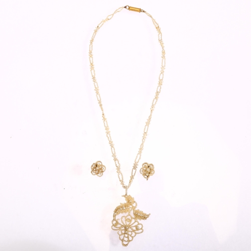 1235 - A Victorian seed pearl and mother-of-pearl openwork pendant necklace and pair of earrings set, with ... 