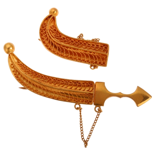 1236 - A Middle Eastern gold filigree dagger brooch, length 54.9mm, and another similar sheath, 9.5g total ... 