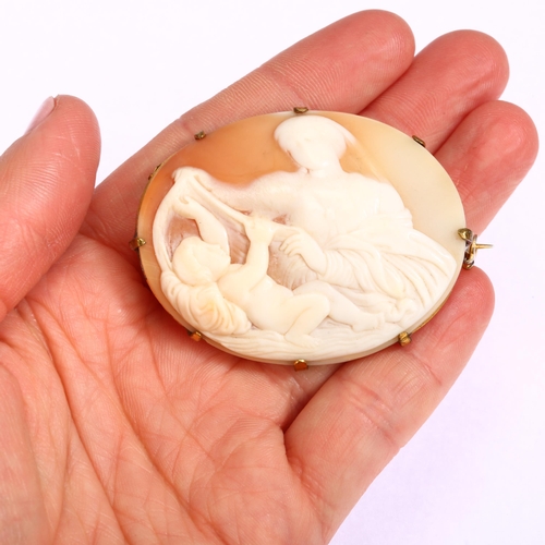 1245 - A Victorian shell cameo brooch, relief carved depicting mother and child, in gilt-metal frame, width... 