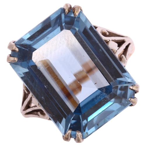 1246 - A 9ct gold blue topaz dress ring, setting height 16.4mm, size K, 5.1g