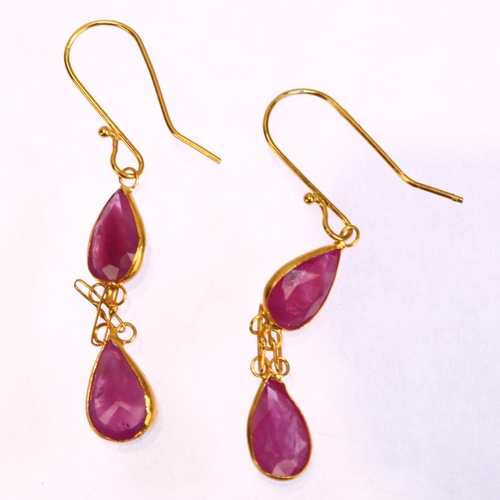 1252 - A pair of 14ct gold ruby drop earrings, set with pear-cut rubies with shepherd hook fittings, height... 