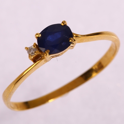 1255 - A 14ct gold sapphire and diamond dress ring, set with oval mixed-cut sapphire and modern round brill... 