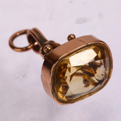 1275 - An Antique 9ct gold citrine fob, and an unmarked gold mounted shell cameo brooch, depicting Hebe fee... 