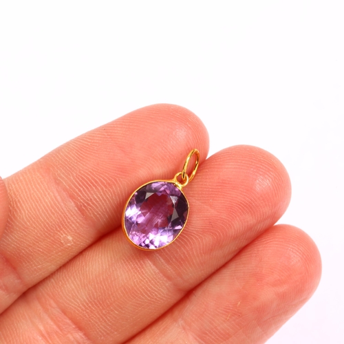 1278 - A 14ct gold solitaire amethyst pendant, bezel set with oval mixed-cut amethyst, height 17.3mm, 0.8g