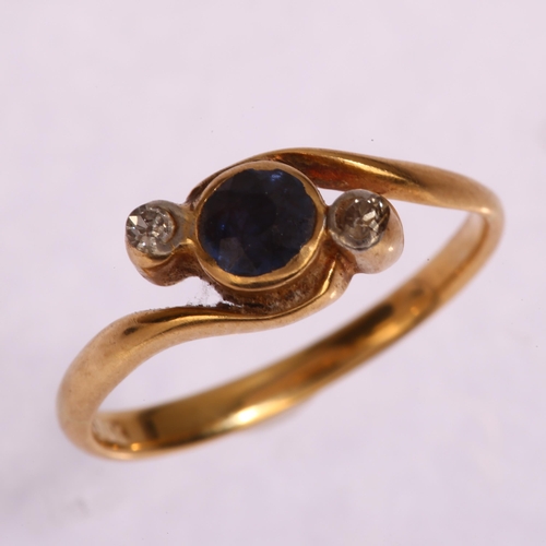 1283 - An 18ct gold three stone sapphire and diamond crossover ring, setting height 6.3mm, size I, 2g