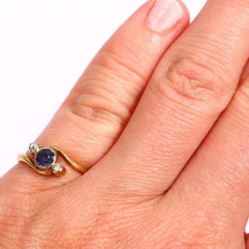 1283 - An 18ct gold three stone sapphire and diamond crossover ring, setting height 6.3mm, size I, 2g