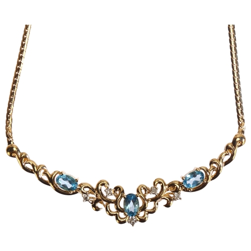 1289 - A modern 9ct gold blue topaz and diamond collar necklace, length 44cm, 8.1g