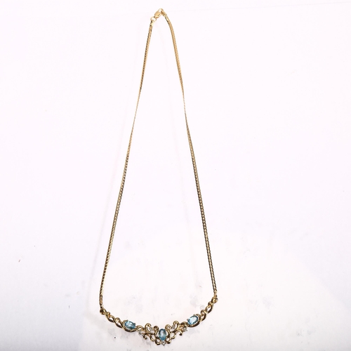 1289 - A modern 9ct gold blue topaz and diamond collar necklace, length 44cm, 8.1g