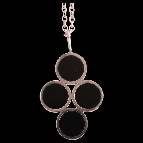 1294 - ARNE JOHANSEN - a Danish sterling silver and onyx abstract design pendant on sterling silver chain, ... 